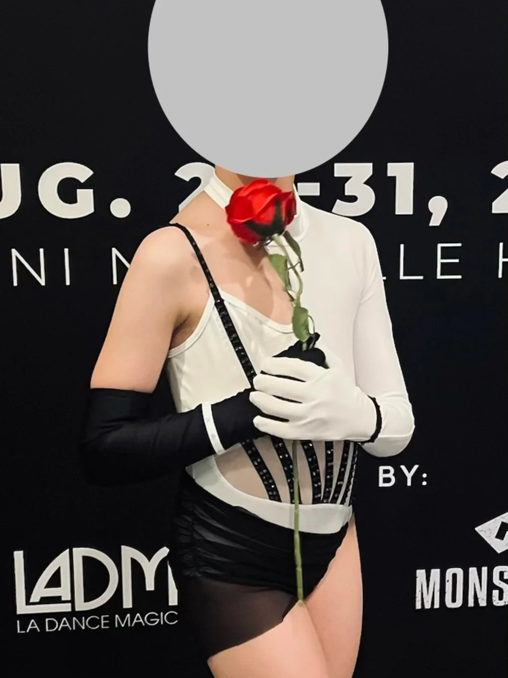 White and Black Asymmetric Dance leotard with Mesh Draping and cap.